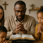 A family gathered around the table, praying before starting to study the Bible together